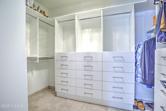 218 W Milbrae Springs Dr, Oro Valley, AZ 85755 - spacious closet with light tile patterned floors