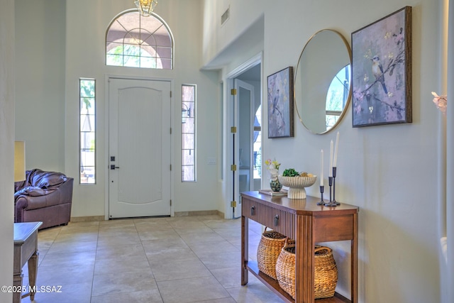 218 W Milbrae Springs Dr, Oro Valley, AZ 85755 - entrance foyer featuring plenty of natural light, baseboards, a high ceiling, and light tile patterned floors
