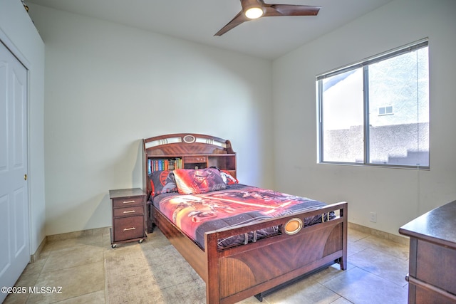 218 W Milbrae Springs Dr, Oro Valley, AZ 85755 - bedroom with a closet, baseboards, ceiling fan, and light tile patterned flooring