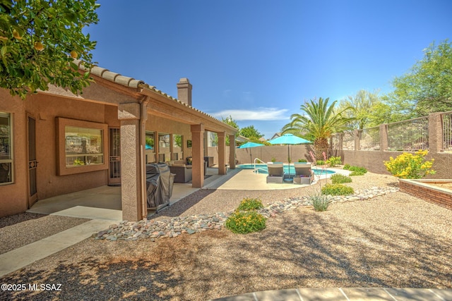 218 W Milbrae Springs Dr, Oro Valley, AZ 85755 - fenced backyard featuring a patio and outdoor lounge area