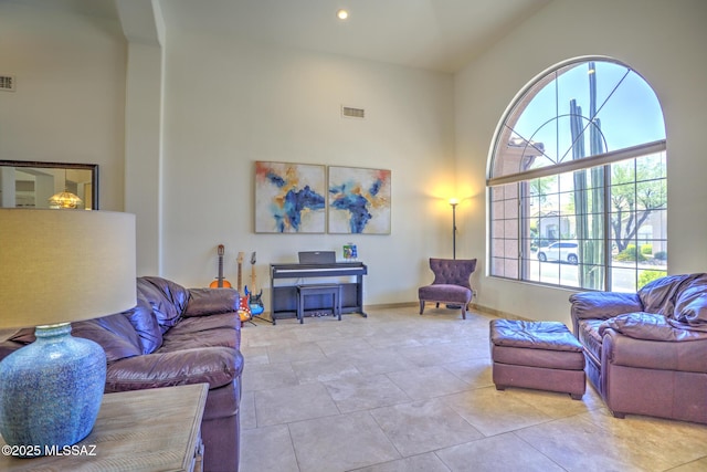 218 W Milbrae Springs Dr, Oro Valley, AZ 85755 - living area with a high ceiling, baseboards, and recessed lighting