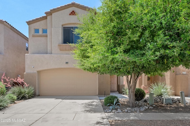 2247 W Night Air Ln, Tucson, AZ 85741 - view of front facade with stucco siding, an attached garage, and concrete driveway