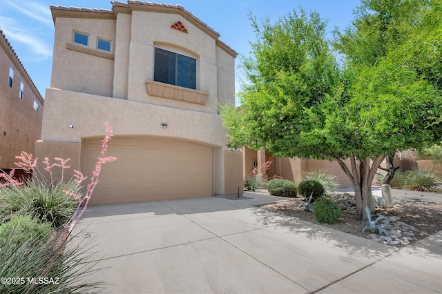 2247 W Night Air Ln, Tucson, AZ 85741 - view of front of home featuring stucco siding, a garage, and concrete driveway