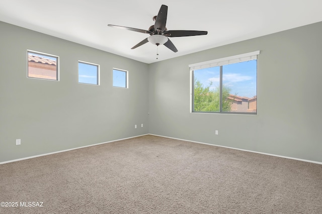 2247 W Night Air Ln, Tucson, AZ 85741 - carpeted spare room featuring a ceiling fan and baseboards