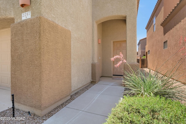 2247 W Night Air Ln, Tucson, AZ 85741 - property entrance with stucco siding and a garage