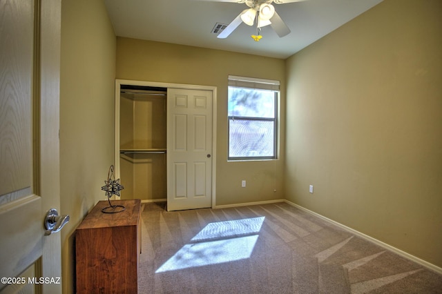 11113 N Rams Horn Trl N, Oro Valley, AZ 85737 - unfurnished bedroom featuring carpet flooring, a closet, baseboards, and ceiling fan