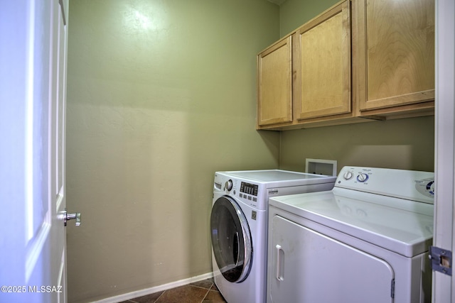 11113 N Rams Horn Trl N, Oro Valley, AZ 85737 - washroom featuring cabinet space, washer and clothes dryer, dark tile patterned floors, and baseboards
