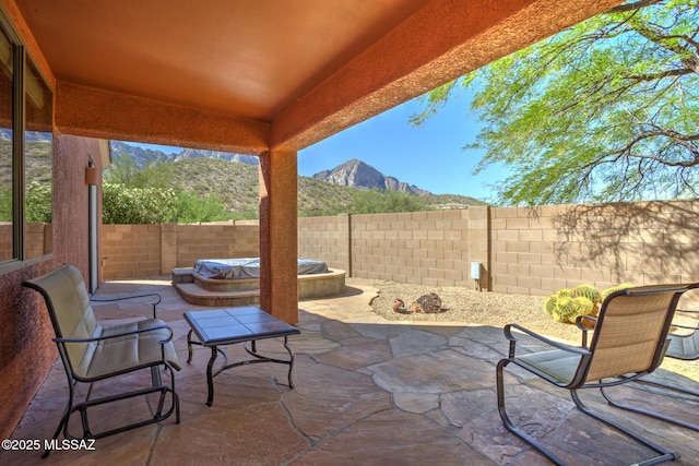11113 N Rams Horn Trl N, Oro Valley, AZ 85737 - fenced backyard with a mountain view, an outdoor hot tub, and a patio