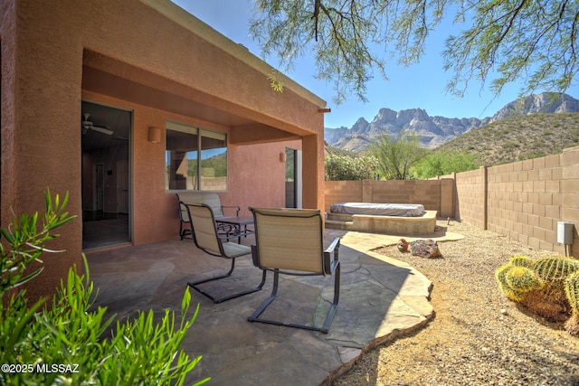 11113 N Rams Horn Trl N, Oro Valley, AZ 85737 - fenced backyard with a covered hot tub, a patio, and a mountain view