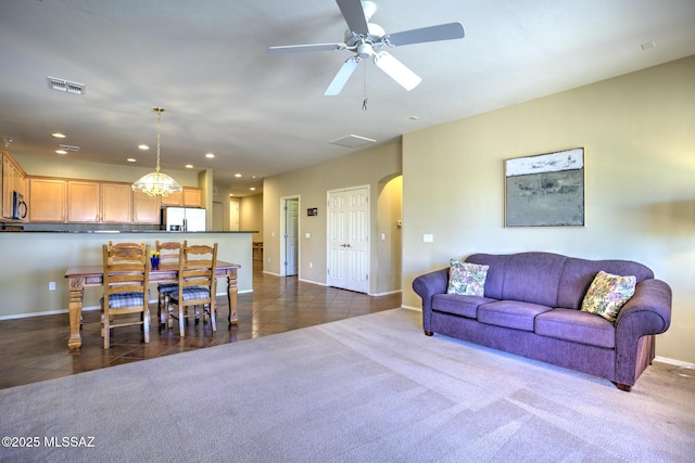 11113 N Rams Horn Trl N, Oro Valley, AZ 85737 - living room featuring arched walkways, baseboards, recessed lighting, ceiling fan, and dark tile patterned flooring