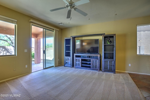 11113 N Rams Horn Trl N, Oro Valley, AZ 85737 - unfurnished living room featuring ceiling fan, carpet, and baseboards