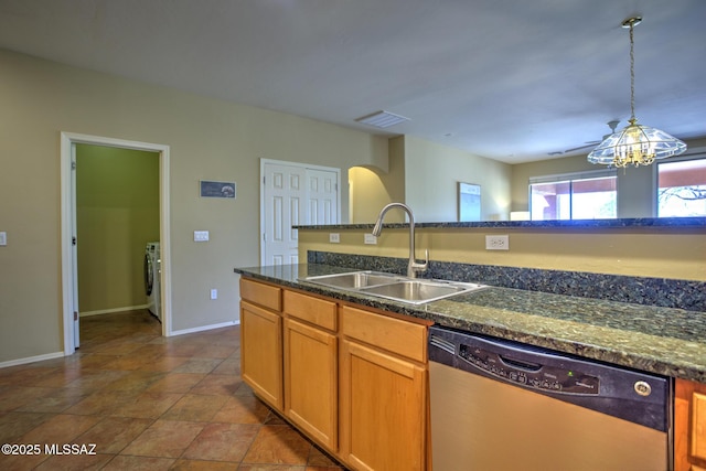 11113 N Rams Horn Trl N, Oro Valley, AZ 85737 - kitchen featuring stainless steel dishwasher, a sink, washer / clothes dryer, arched walkways, and hanging light fixtures