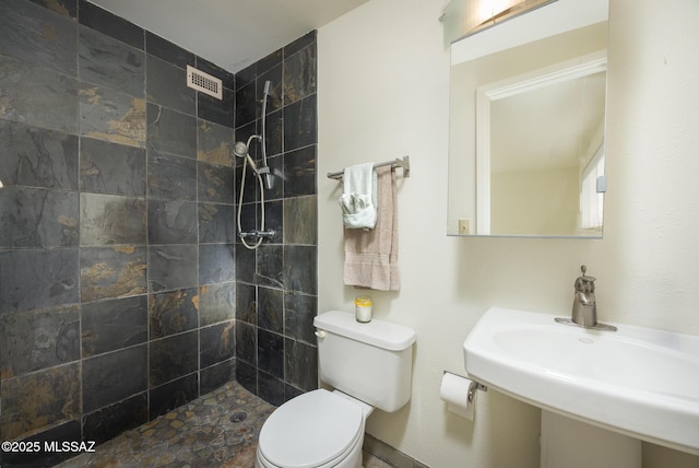 3025 E Blacklidge Dr, Tucson, AZ 85716 - full bathroom with toilet, tiled shower, and a sink