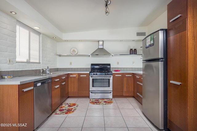 3025 E Blacklidge Dr, Tucson, AZ 85716 - kitchen with appliances with stainless steel finishes, wall chimney range hood, light tile patterned floors, light countertops, and open shelves