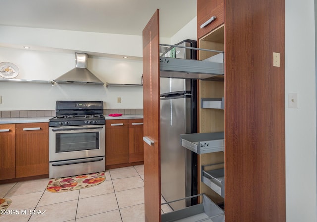 3025 E Blacklidge Dr, Tucson, AZ 85716 - kitchen featuring wall chimney exhaust hood, gas range, open shelves, and brown cabinetry