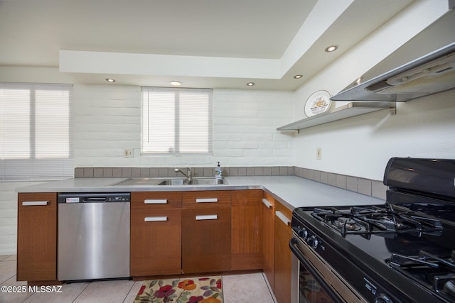 3025 E Blacklidge Dr, Tucson, AZ 85716 - kitchen featuring range with gas cooktop, dishwasher, ventilation hood, light tile patterned floors, and light countertops