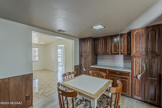 6158 E Calle Aurora, Tucson, AZ 85711 - dining room with light wood-style floors