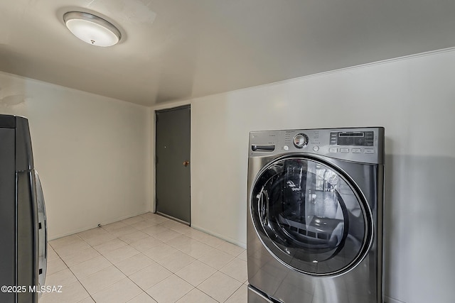 6158 E Calle Aurora, Tucson, AZ 85711 - washroom with washer / clothes dryer, baseboards, and light tile patterned floors