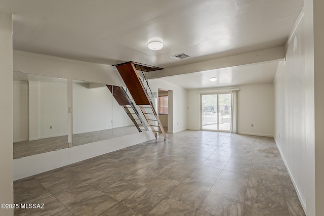 6158 E Calle Aurora, Tucson, AZ 85711 - below grade area with baseboards and stairway