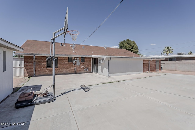 6158 E Calle Aurora, Tucson, AZ 85711 - rear view of house featuring brick siding, fence, and a patio area