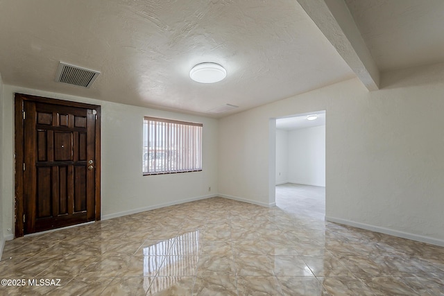 6158 E Calle Aurora, Tucson, AZ 85711 - foyer featuring lofted ceiling and a textured ceiling