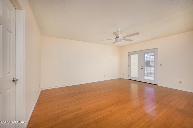 9846 E 2nd St, Tucson, AZ 85748 - unfurnished room featuring light wood-style floors, ceiling fan, french doors, baseboards, and a textured ceiling