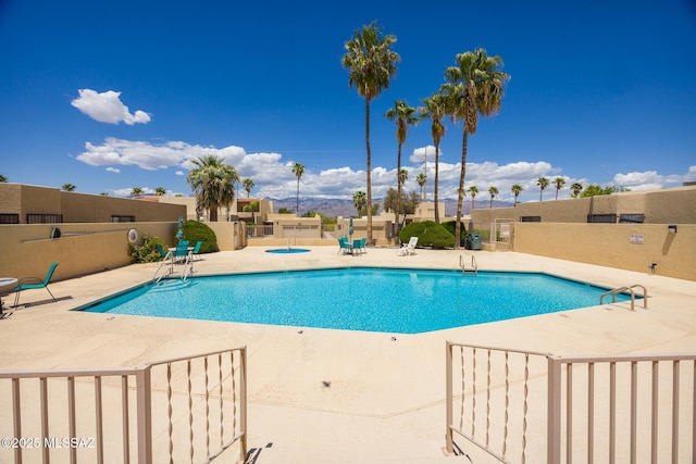 9846 E 2nd St, Tucson, AZ 85748 - community pool featuring a patio and fence