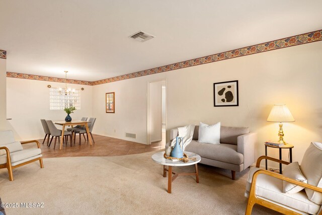 2826 E Kleindale Rd, Tucson, AZ 85716 - carpeted living area with a chandelier
