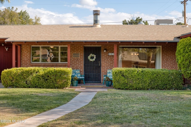 2826 E Kleindale Rd, Tucson, AZ 85716 - single story home with brick siding, a front lawn, and roof with shingles