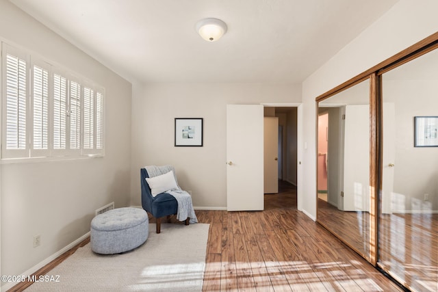 2826 E Kleindale Rd, Tucson, AZ 85716 - living area featuring wood finished floors and baseboards