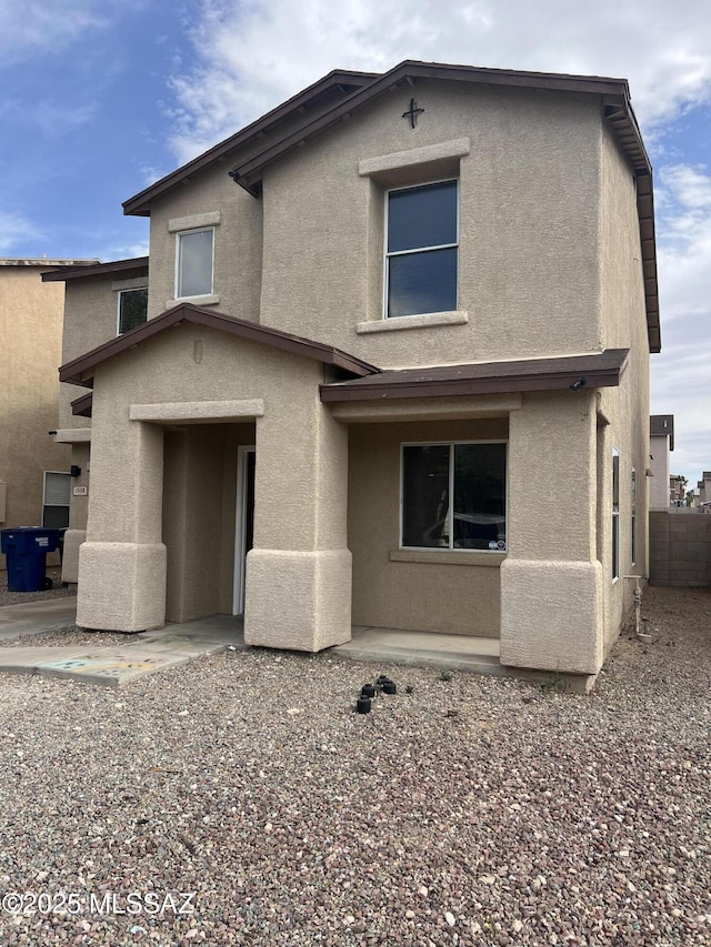 1558 E Los Cabos Pl, Tucson, AZ 85706 - rear view of house featuring stucco siding and fence