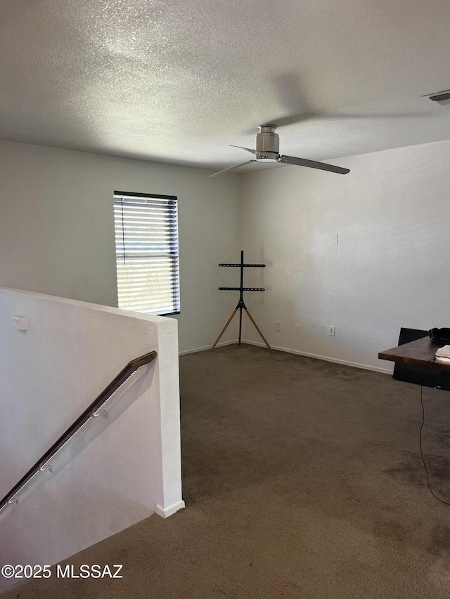1558 E Los Cabos Pl, Tucson, AZ 85706 - unfurnished room with carpet floors, a ceiling fan, a textured ceiling, and baseboards