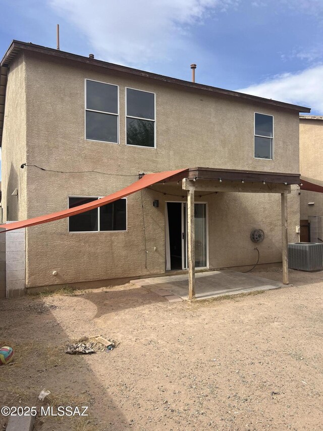 1558 E Los Cabos Pl, Tucson, AZ 85706 - rear view of house with a patio area, stucco siding, and central air condition unit