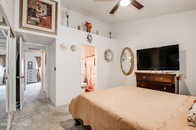 10095 E Autumnwind Pl, Tucson, AZ 85730 - bedroom with light carpet, ensuite bath, and baseboards