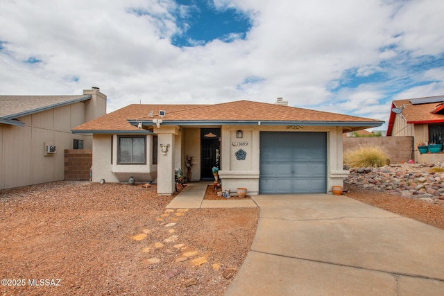 10095 E Autumnwind Pl, Tucson, AZ 85730 - ranch-style home featuring a garage, driveway, fence, a shingled roof, and stucco siding