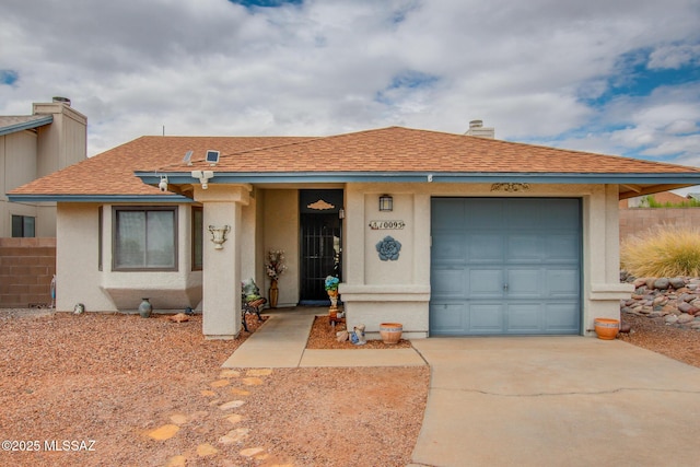 10095 E Autumnwind Pl, Tucson, AZ 85730 - single story home with a garage, fence, concrete driveway, stucco siding, and roof with shingles