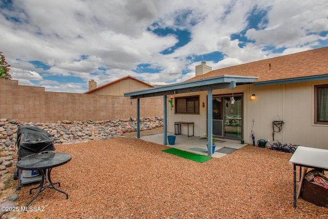 10095 E Autumnwind Pl, Tucson, AZ 85730 - rear view of property with a patio, a fenced backyard, and a chimney