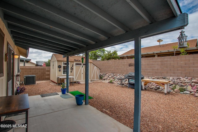 10095 E Autumnwind Pl, Tucson, AZ 85730 - view of patio / terrace with a fenced backyard, central AC, a storage unit, and an outdoor structure