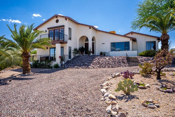 1861 N Camino Claveles, Tucson, AZ 85745 - mediterranean / spanish-style home featuring a balcony and stucco siding
