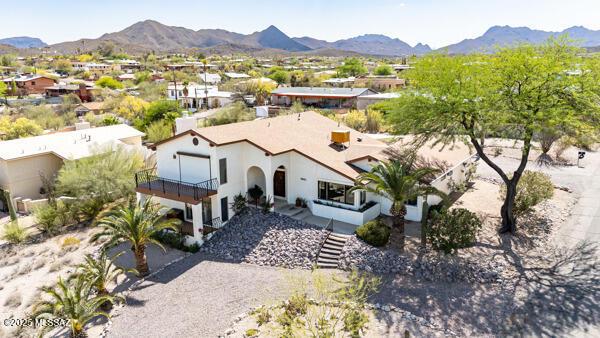 1861 N Camino Claveles, Tucson, AZ 85745 - aerial perspective of suburban area featuring a mountain backdrop