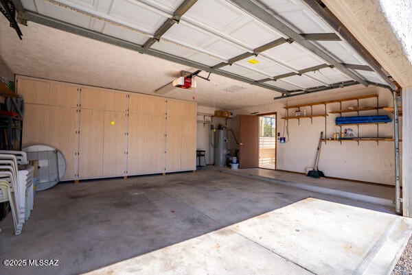 1861 N Camino Claveles, Tucson, AZ 85745 - garage featuring electric water heater and a garage door opener