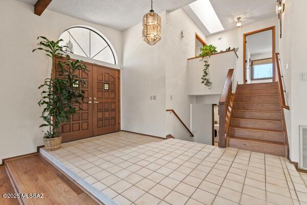 1861 N Camino Claveles, Tucson, AZ 85745 - foyer entrance with stairs and wood finished floors