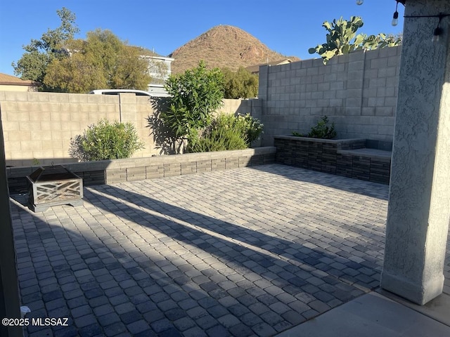 3756 W Exton Ln, Tucson, AZ 85746 - fenced backyard featuring a patio area and a mountain view