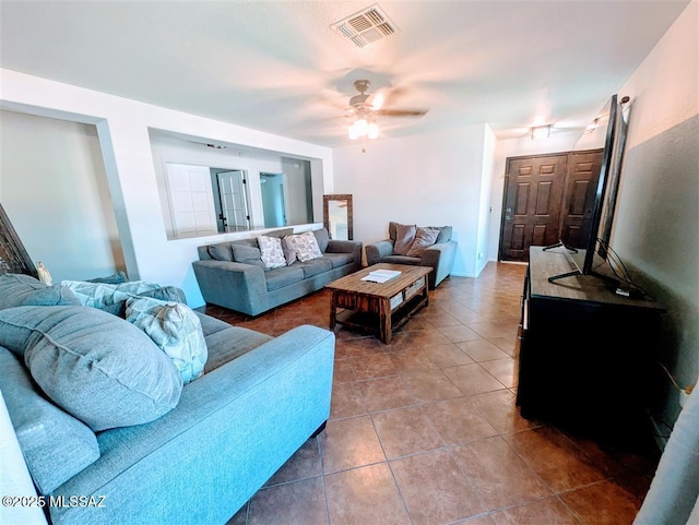 3756 W Exton Ln, Tucson, AZ 85746 - living area with dark tile patterned floors and a ceiling fan