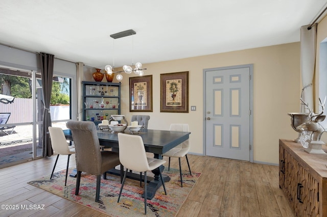 210 S Abrego Dr, Green Valley, AZ 85614 - dining room featuring a chandelier and light wood finished floors