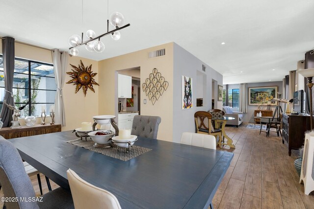 210 S Abrego Dr, Green Valley, AZ 85614 - dining space with healthy amount of natural light and wood finished floors