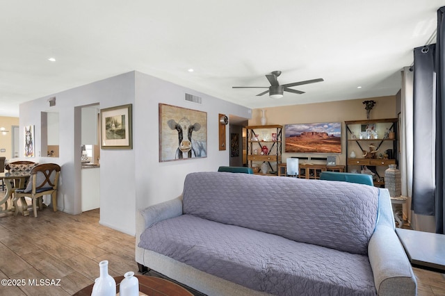 210 S Abrego Dr, Green Valley, AZ 85614 - living room with light wood-style flooring, ceiling fan, and recessed lighting