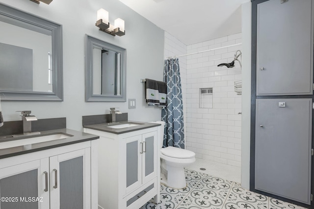 210 S Abrego Dr, Green Valley, AZ 85614 - full bath featuring a tile shower, two vanities, tile patterned floors, and toilet