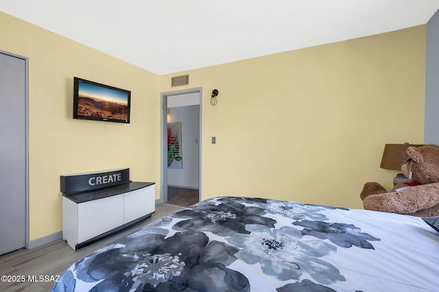 210 S Abrego Dr, Green Valley, AZ 85614 - bedroom featuring light wood-style flooring and baseboards