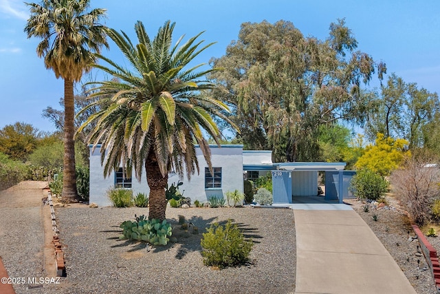 210 S Abrego Dr, Green Valley, AZ 85614 - view of front facade with concrete driveway, stucco siding, and a carport